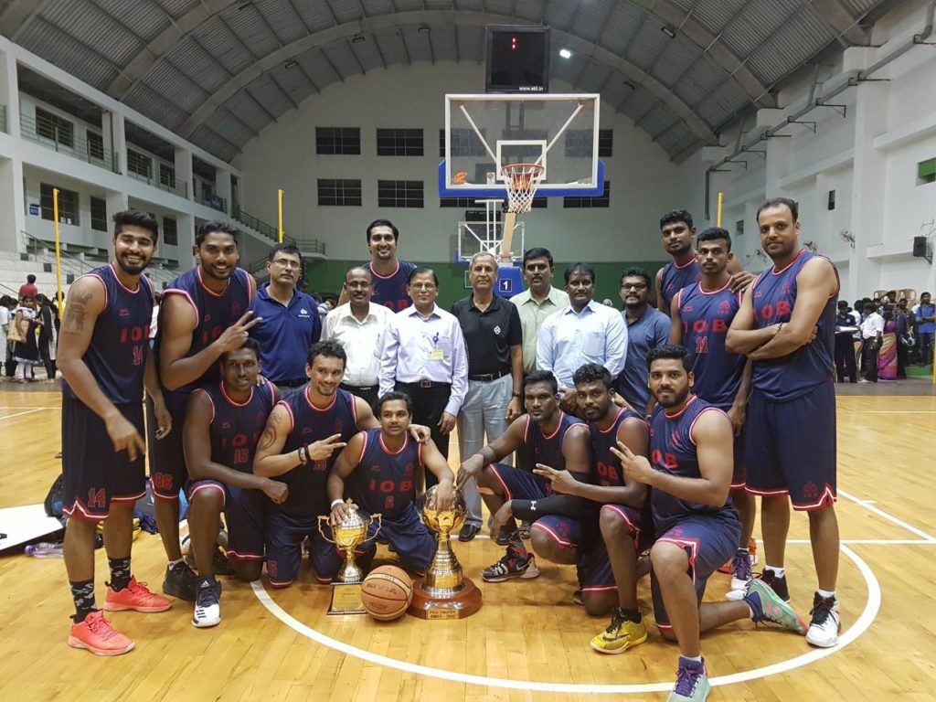 Indian Overseas Bank (IOB) basketball team including Aravind Annadurai, Mihir Pandey, Rikin Pethani, Pratham Singh, Prasanna Venkatesh.